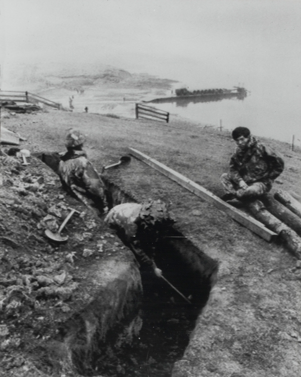 Men of 1st Battalion, 7th Gurkha Rifles, digging defensive positions on the shore of San Carlos Bay, Falkland Islands, 1982