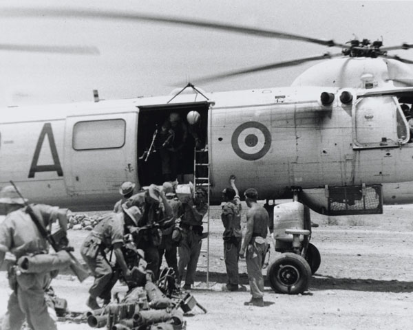 Disembarking from a Bristol Belvedere helicopter in Radfan, 1964