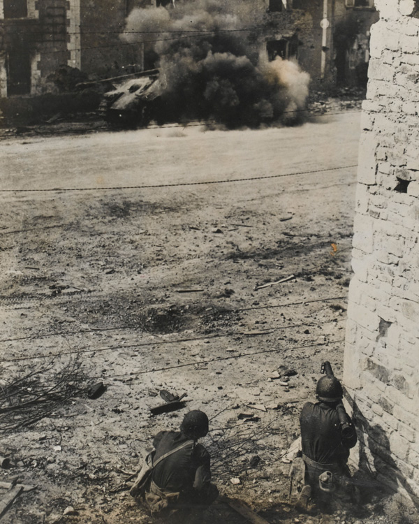 An American bazooka knocks out a German tank, September 1944