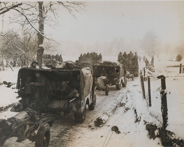 Reinforcements from the US 1st Army pass through Fosee in the Ardennes, December 1944