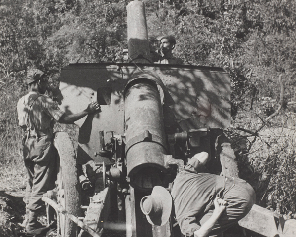 Inspecting a Japanese 105mm gun abandoned on the Tiddim Road near Imphal, 1944