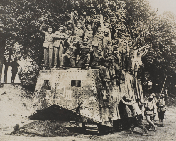Allied soldiers on the roof of a captured A7V tank, 1918
