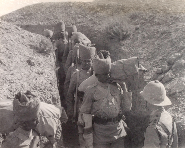 Indian troops passing through a communication trench, 1917 
