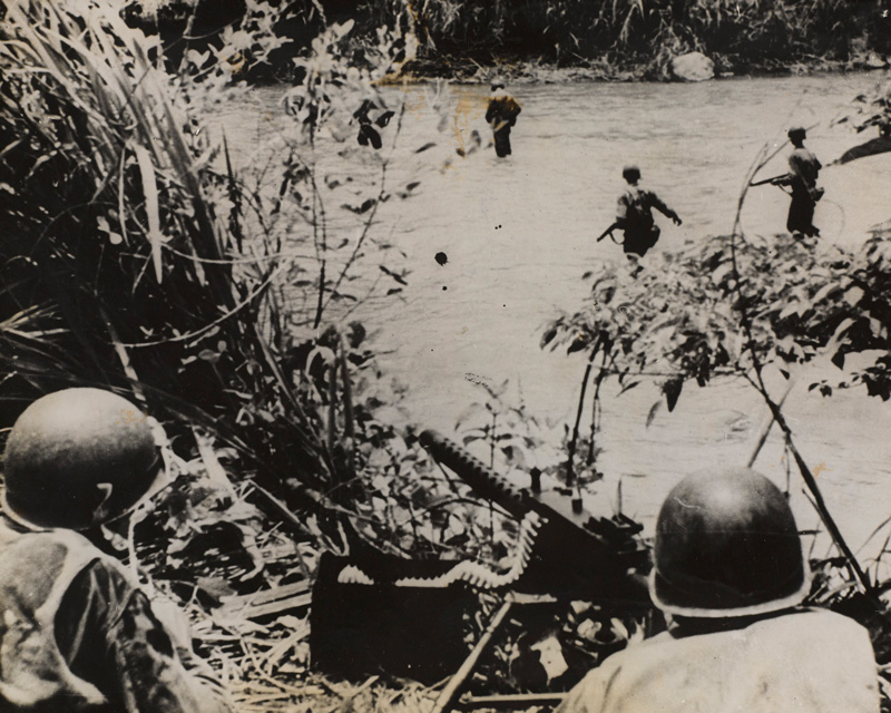 American infantry cross a jungle stream covered by a machine gun, New Guinea, c1943 