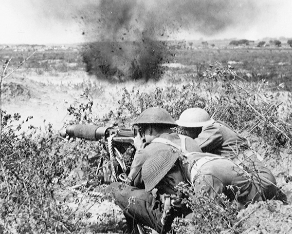 Soldiers of the Middlesex Regiment open fire with a Vickers Machine Gun, 1944