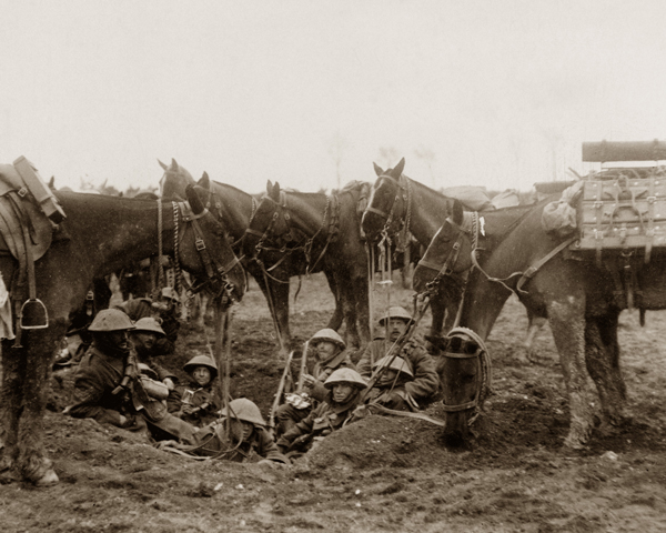 Cavalrymen resting in a shell hole during the Battle of the Scarpe, April 1917