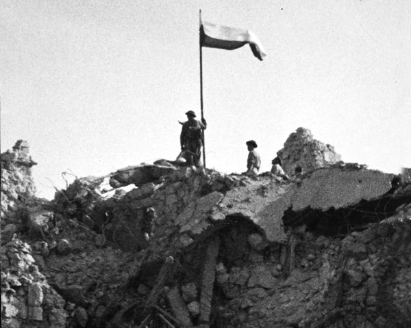 Poles of the 3rd Carpathian Division raising their flag over Monte Cassino, May 1944