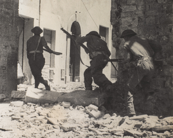 Infantry moving through the streets of Castiglione, November 1944