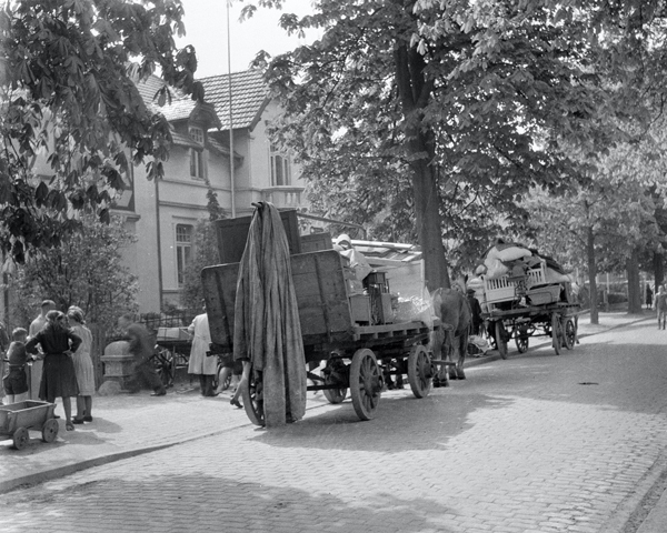 Civilians evacuate following the Army requisition of their homes, Elmshorn, 1945