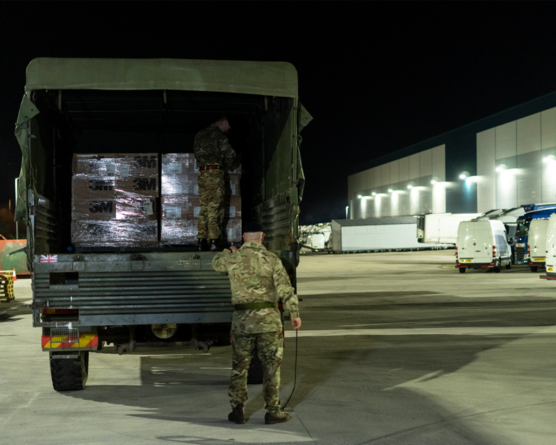 A Royal Logistics Corps lorry collects face masks for delivery to NHS locations in London, March 2020 