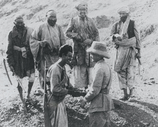 Major M C Holmes conferring with Afridi tribesmen, c1925