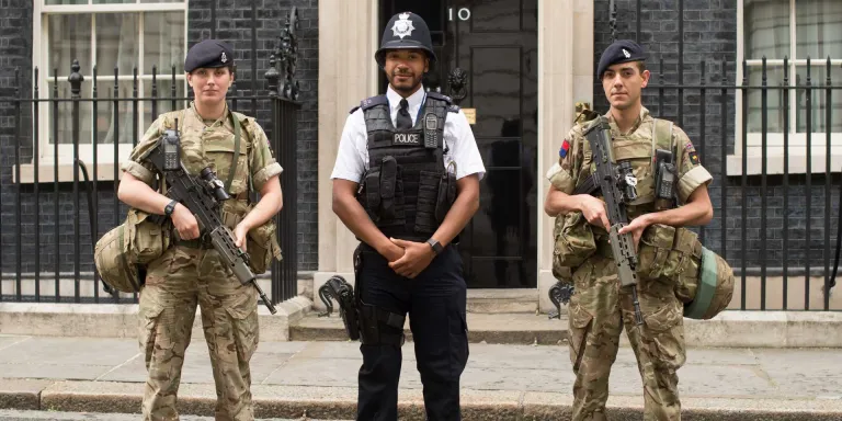 Soldiers of The King's Troop, Royal Horse Artillery, perform security duties at 10 Downing Street alongside armed police officers, Operation Temperer, May 2017