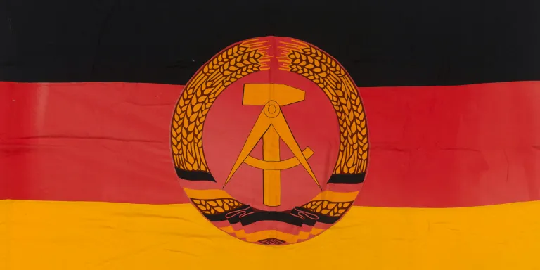 East German flag taken from outside the Soviet Military Cemetery at Treptow Park in East Berlin by a member of BRIXMIS, 1974