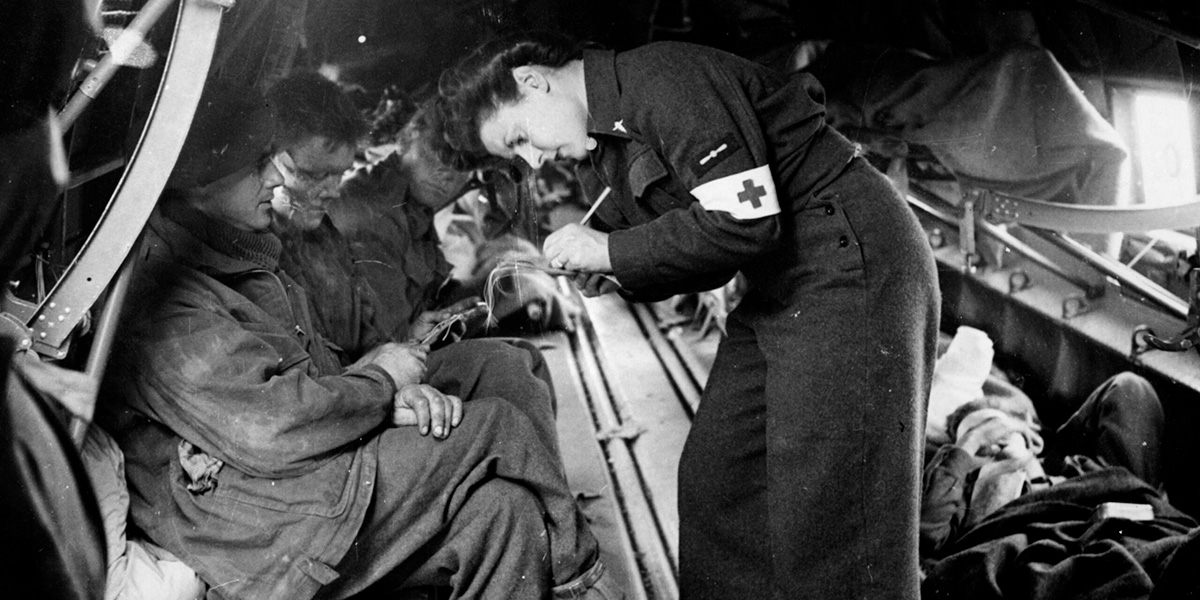 Leading Aircraftwoman Pearl Bradburn recording details of casualties before take-off from Bazenville, Normandy, 1944