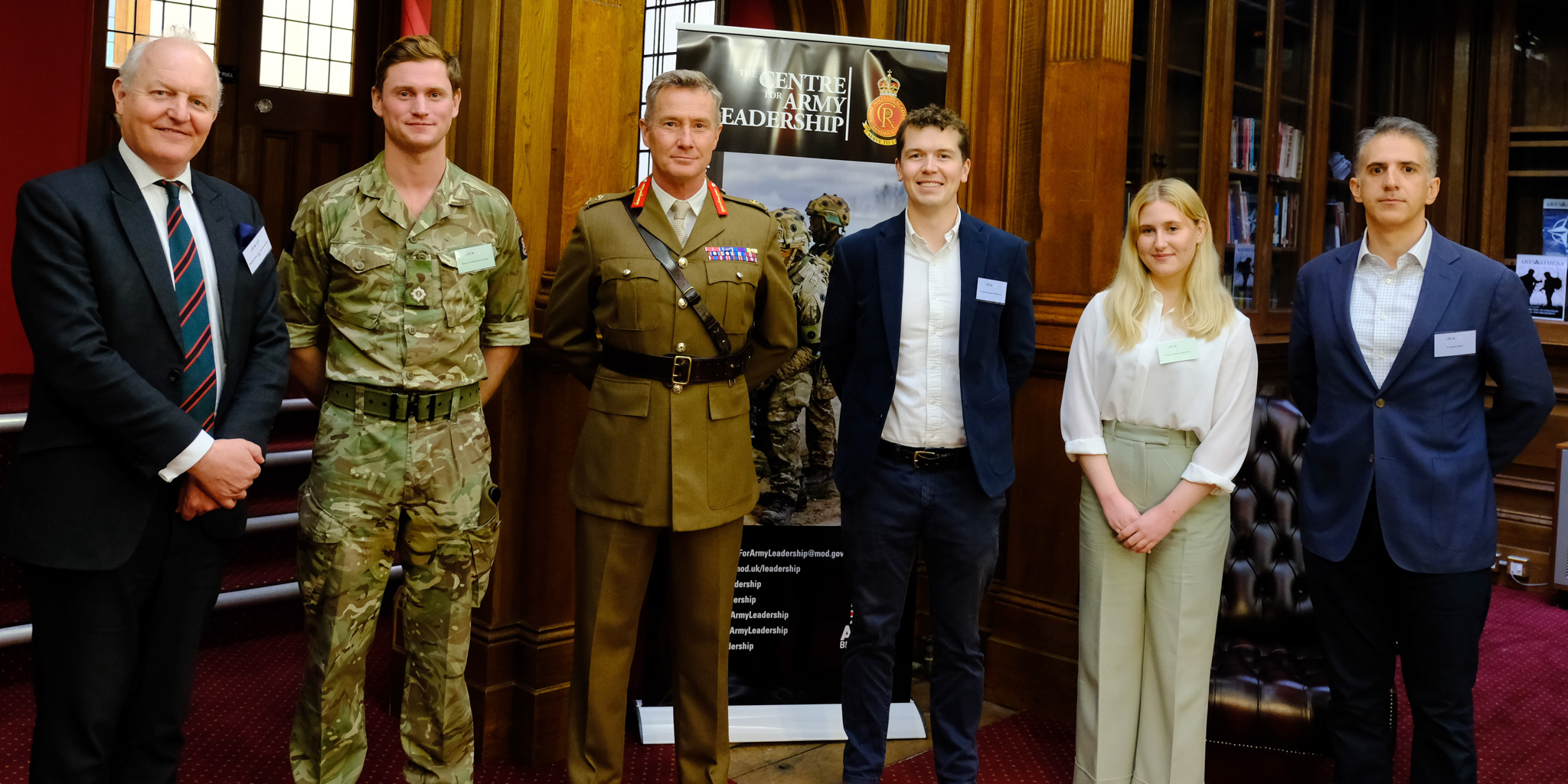 Essay prize winners stand with Museum Director, Justin Maciejewski, and Commandant General Zack Stenning