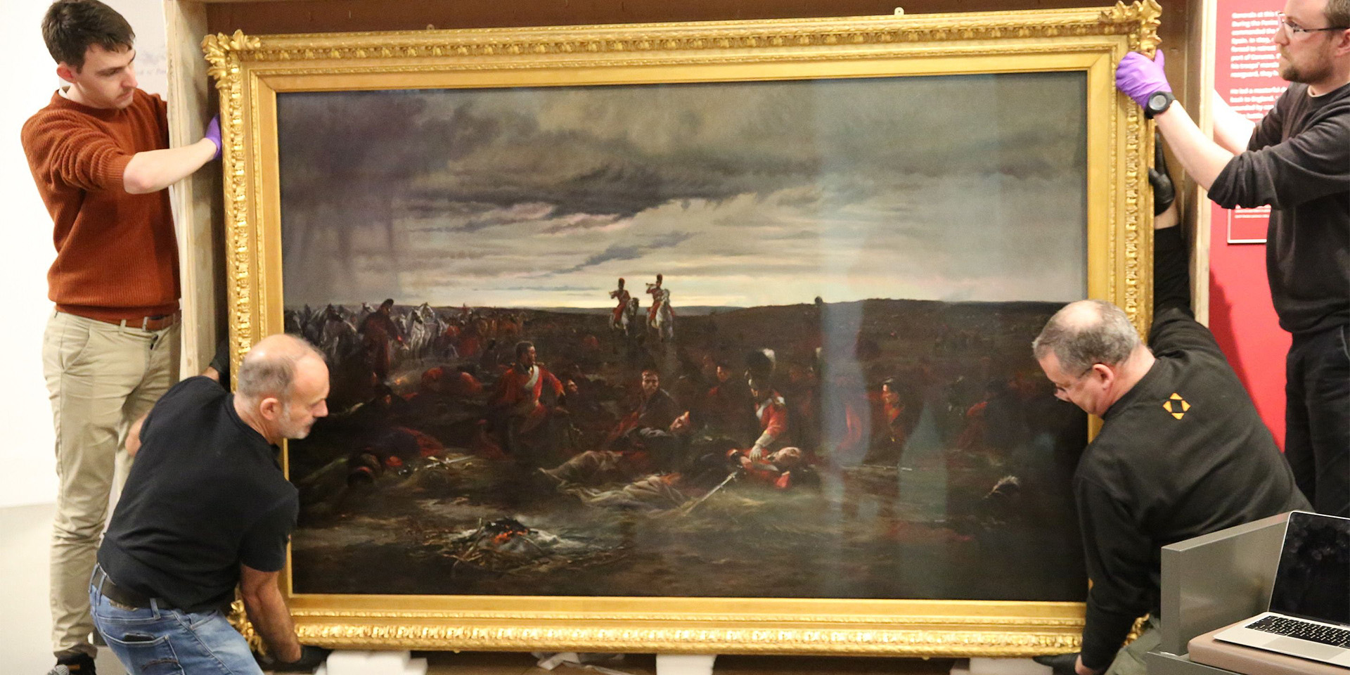 Installing the 'Dawn of Waterloo' painting at the National Army Museum