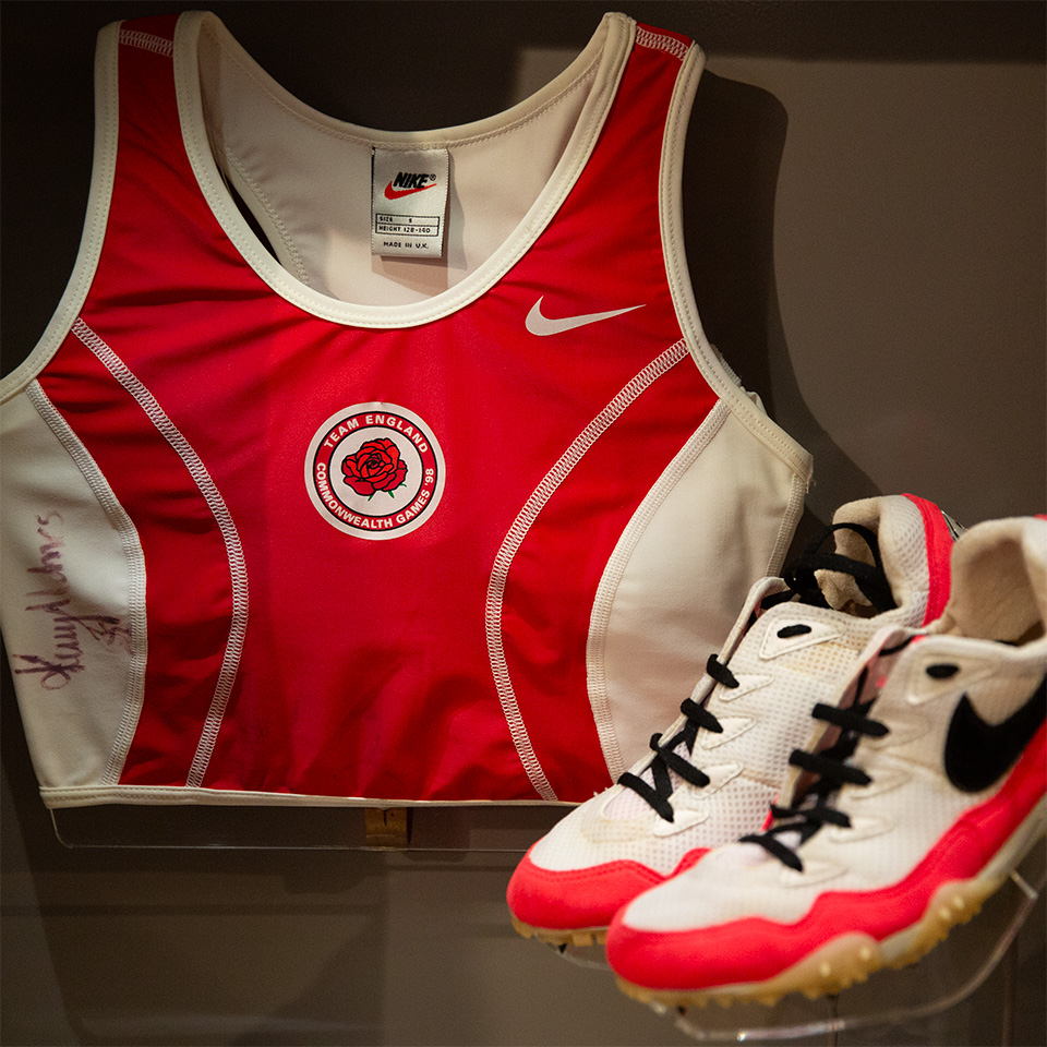 British Army physical training shirt and running shoes worn by Kelly Holmes, c1998