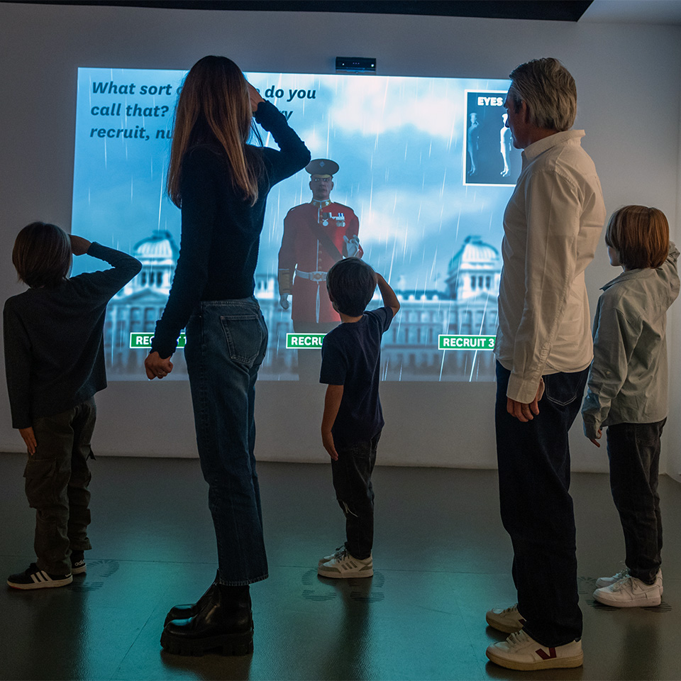 A family being put through their paces by the virtual drill sergeant in the Soldier gallery