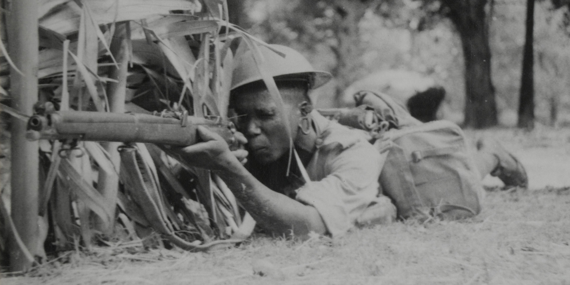 Soldier of the King’s African Rifles covering a road, armed with a Short Magazine Lee-Enfield Rifle, c1943