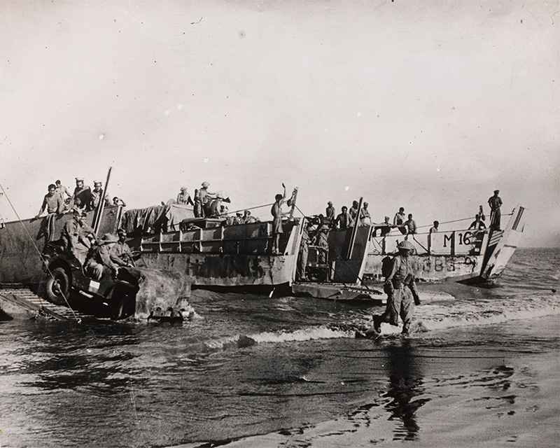 Troops moving ashore from landing craft, Akyab