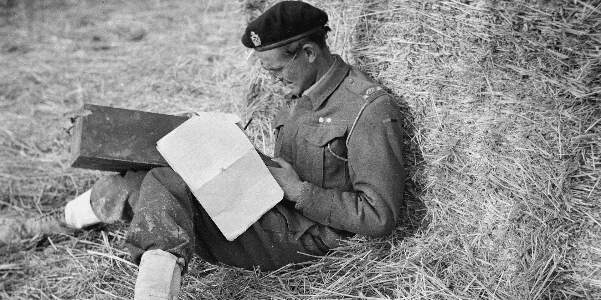 Major Oliver (Ollie) Woods MC filling in his unit’s war diary, Italy, c1943