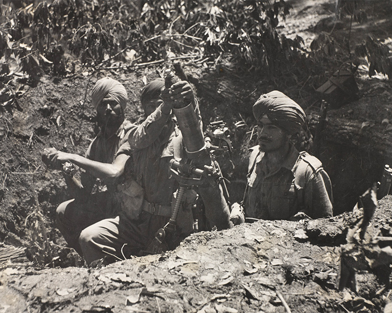 Soldiers of the 2nd Punjab Regiment operating a mortar in Burma, 1945