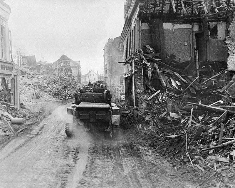 Cromwell tank driving through the devastated German town of Kleve, February 1945