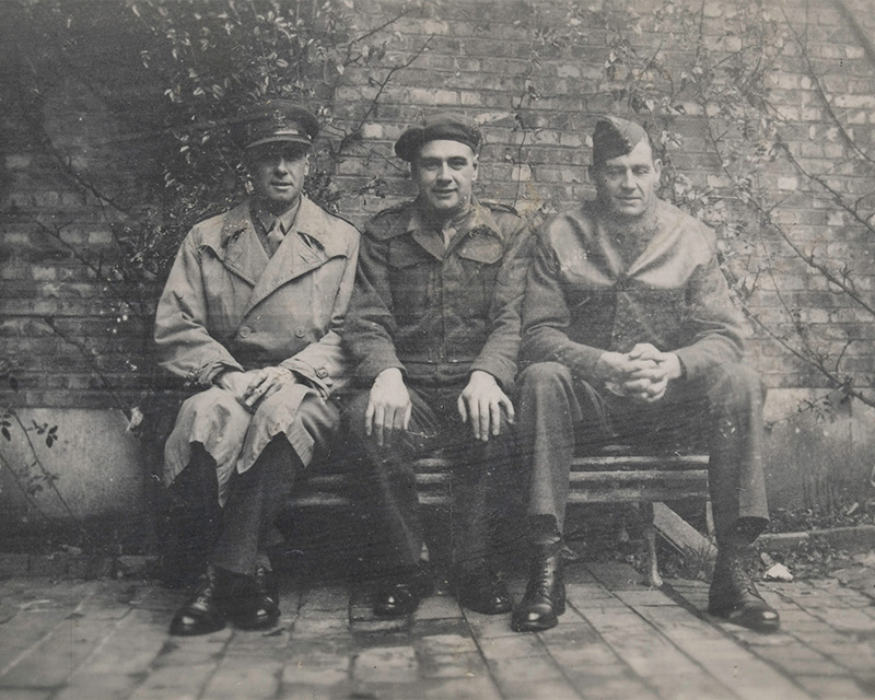 Captain FA Fitton (centre) with two American colleagues at the Civil Affairs Staff Centre, 18 April 1944