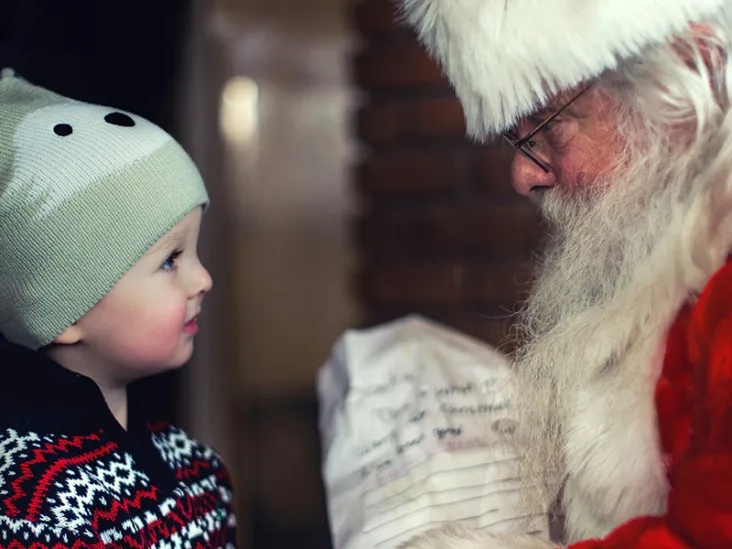 A child visiting Father Christmas