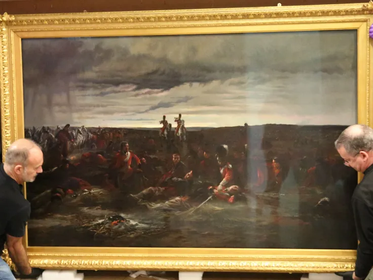 Installing the 'Dawn of Waterloo' painting at the National Army Museum