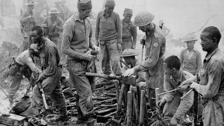 Indian and Gurkha soldiers inspect captured Japanese ordnance, Burma campaign, 1944