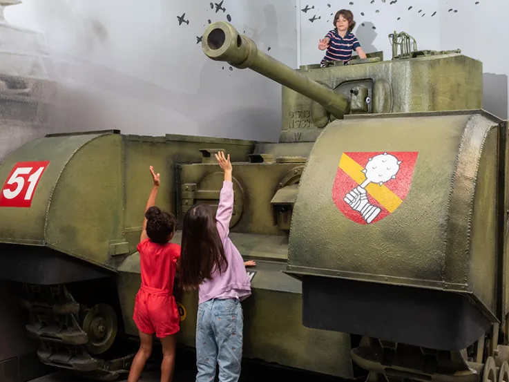 Children playing on the replica tank in the Conflict in Europe gallery