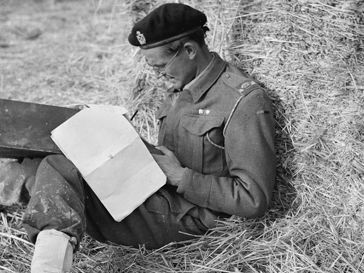 Major Oliver (Ollie) Woods MC filling in his unit’s war diary, Italy, c1943