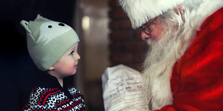 A child visiting Father Christmas